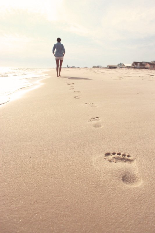 woman walking along a beach